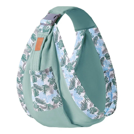 Light blue sling bag with tropical leaf pattern on a white background